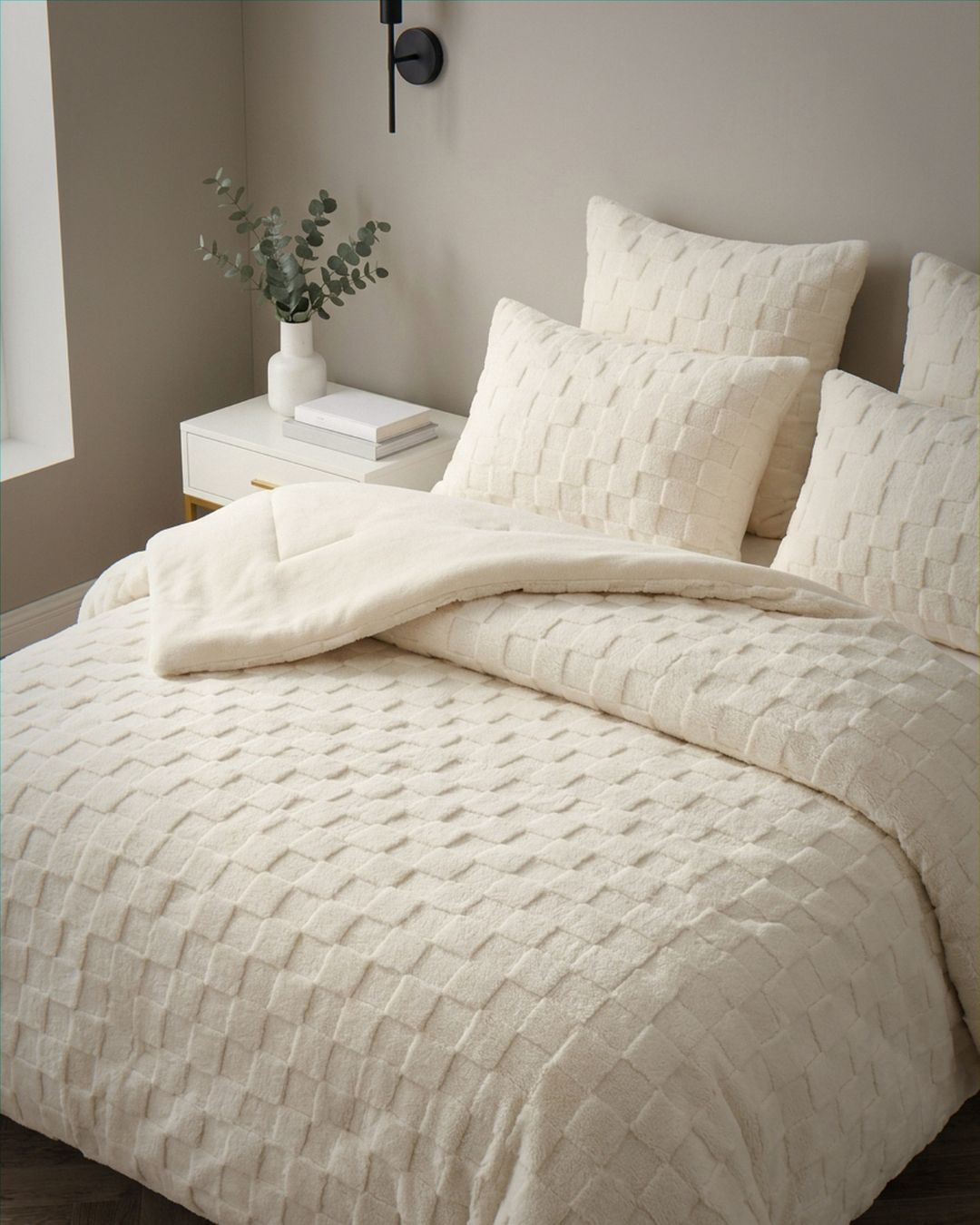 Morgan and Reid Checkered Cream Snuggle Fleece Comforter Set on a bed with matching pillowcases