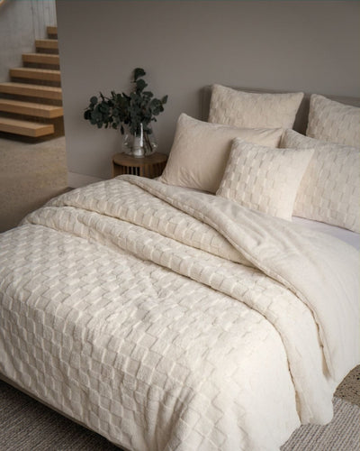 Close-up of the Morgan and Reid Checkered Cream Snuggle Fleece European Pillowcase Pair showing fabric texture