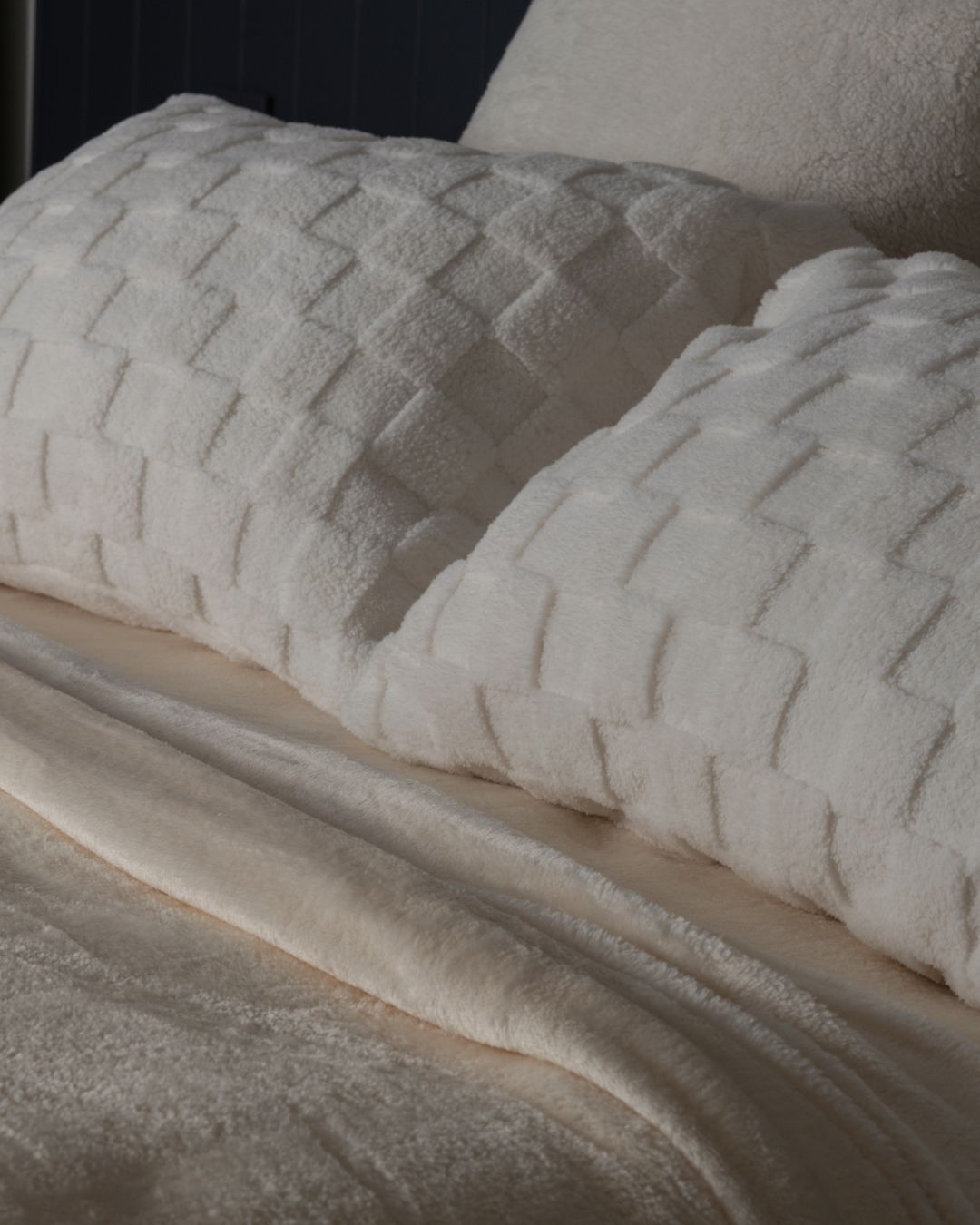 Close-up of the Morgan and Reid Checkered Cream Snuggle Fleece Pillowcase Pair showing fabric texture