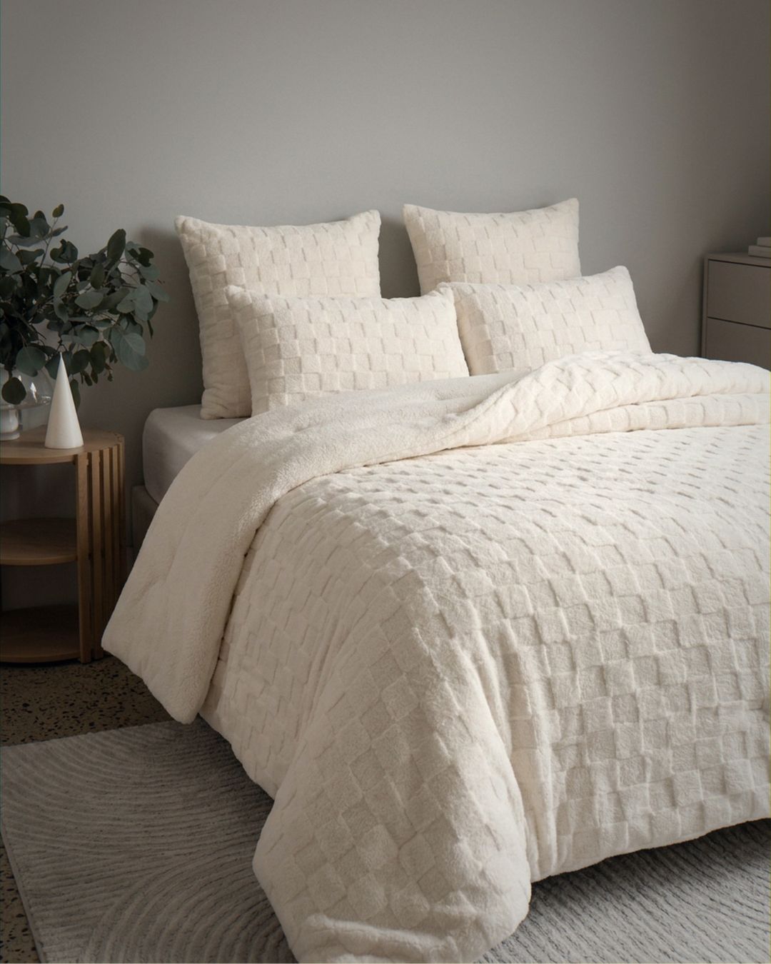 Detail shot of the Morgan and Reid Checkered Cream Snuggle Fleece Pillowcase Pair on pillows