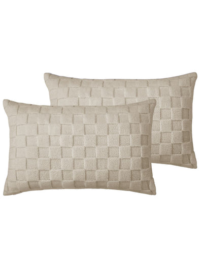 Two woven beige pillows on a white background