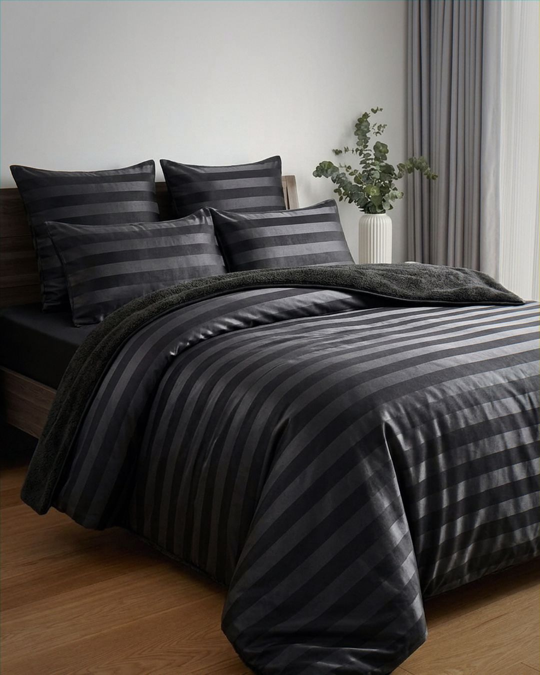 Morgan and Reid Black Velvet Stripe Snuggle Fleece Comforter Set styled on a neatly made bed in a bright bedroom