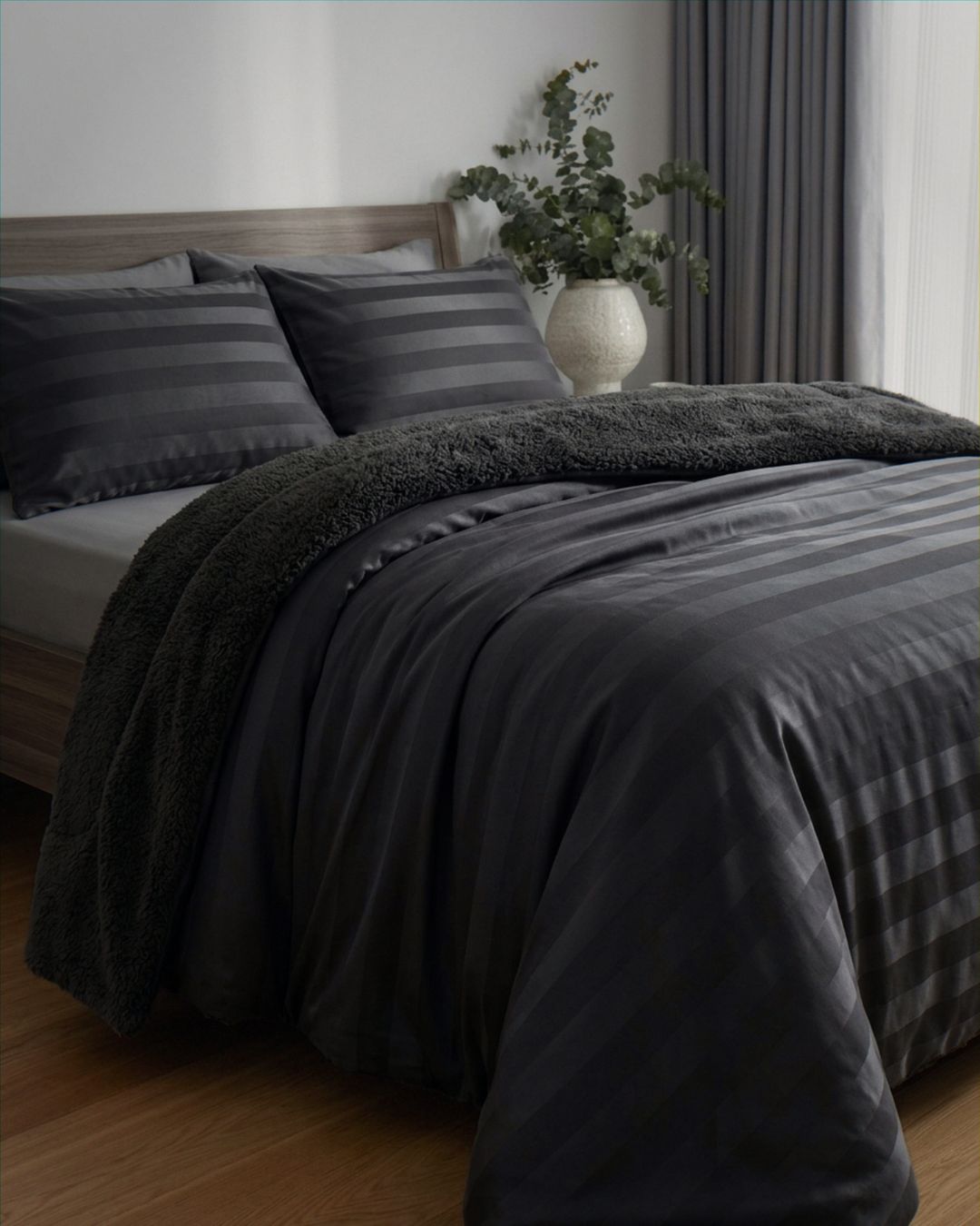 Detail shot of the Morgan and Reid Black Velvet Stripe Crushed Snuggle Fleece Pillowcase Pair on pillows