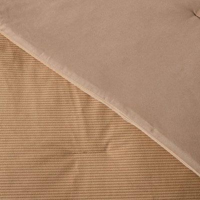 Close-up of a textured brown fabric with a ribbed pattern