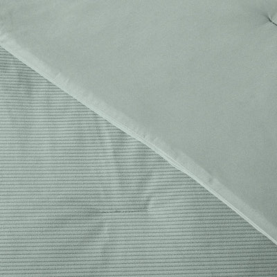 Textured fabric with a diagonal pattern on a light gray background