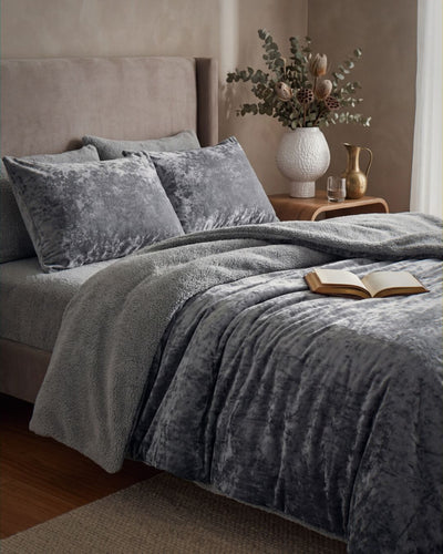 Morgan and Reid Silver Velvet Crushed Snuggle Fleece European Pillowcase Pair on bed with coordinating bedding