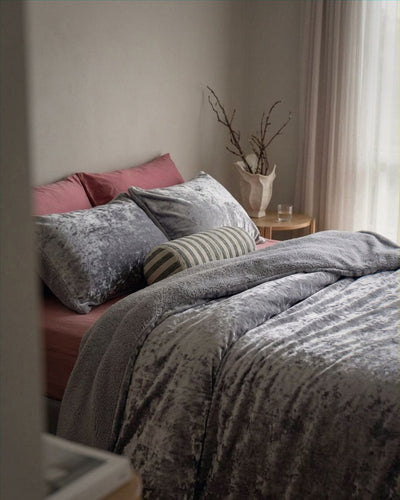 Overhead view of the Morgan and Reid Silver Velvet Crushed Snuggle Fleece Comforter Set on a made bed