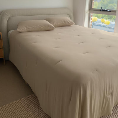 Lightweight doeskin cooling comforter with matching pillowcases.