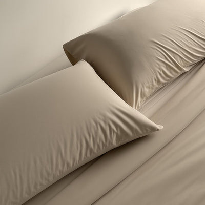 Lightweight doeskin cooling comforter with matching pillowcases.