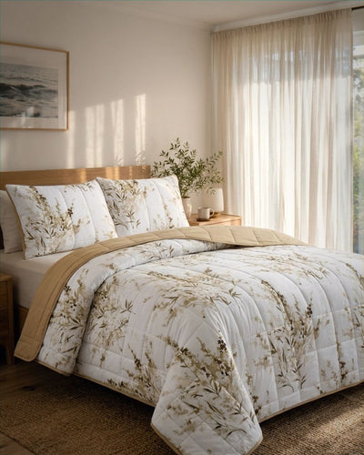 Bedroom with floral bedding and beige throw blanket