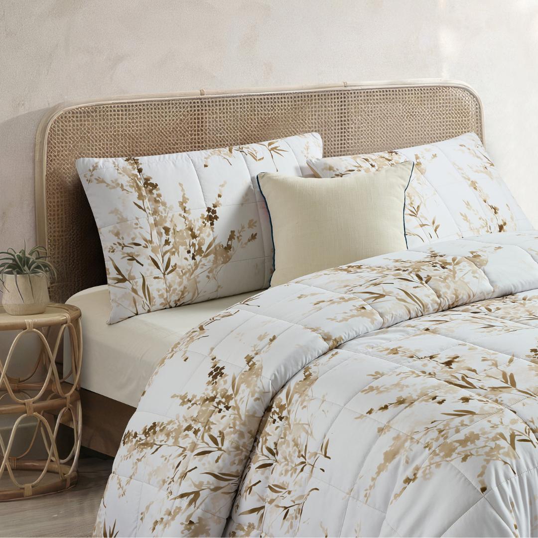 Close-up of golden floral quilted design and stitching.