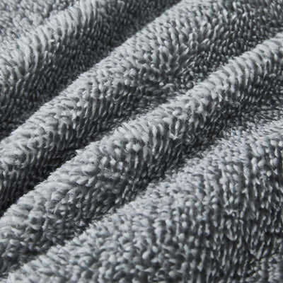 The Morgan and Reid Grey Spec Snuggle Fleece Pillowcase Pair features a modern speckled grey design and ultra-soft fleece, with slightly rounded corners, displayed on a plain white background.