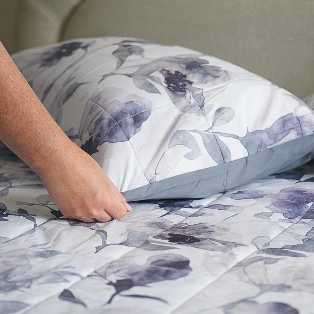Morgan and Reid Midnight Orchid Cloudy Coverlet Set - Close-up of watercolour floral quilted fabric in grey and indigo.