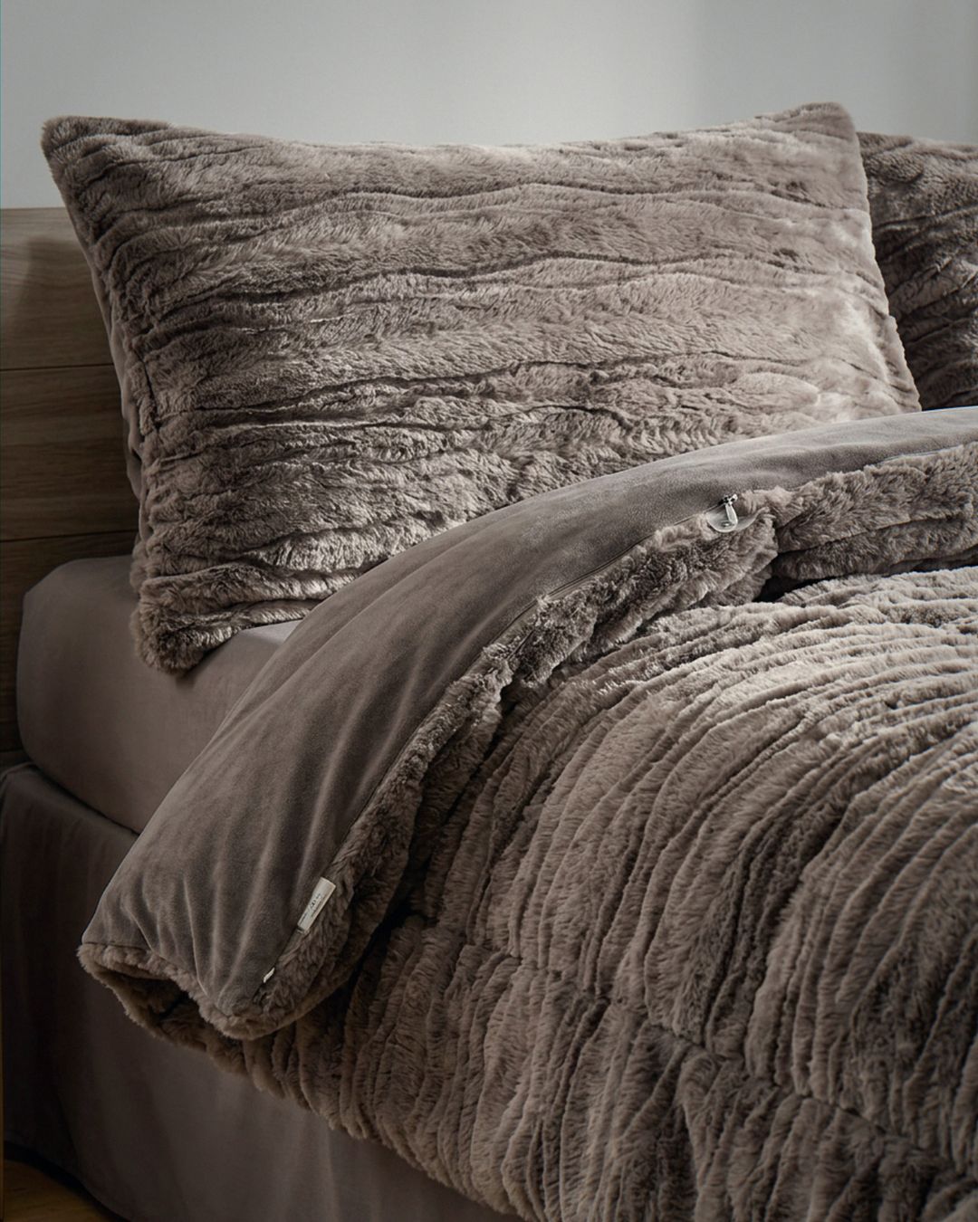 Close-up of the Morgan and Reid Deep Cocoa Snuggle Fleece Rabbit Fur Pillowcase Pair showing fabric texture