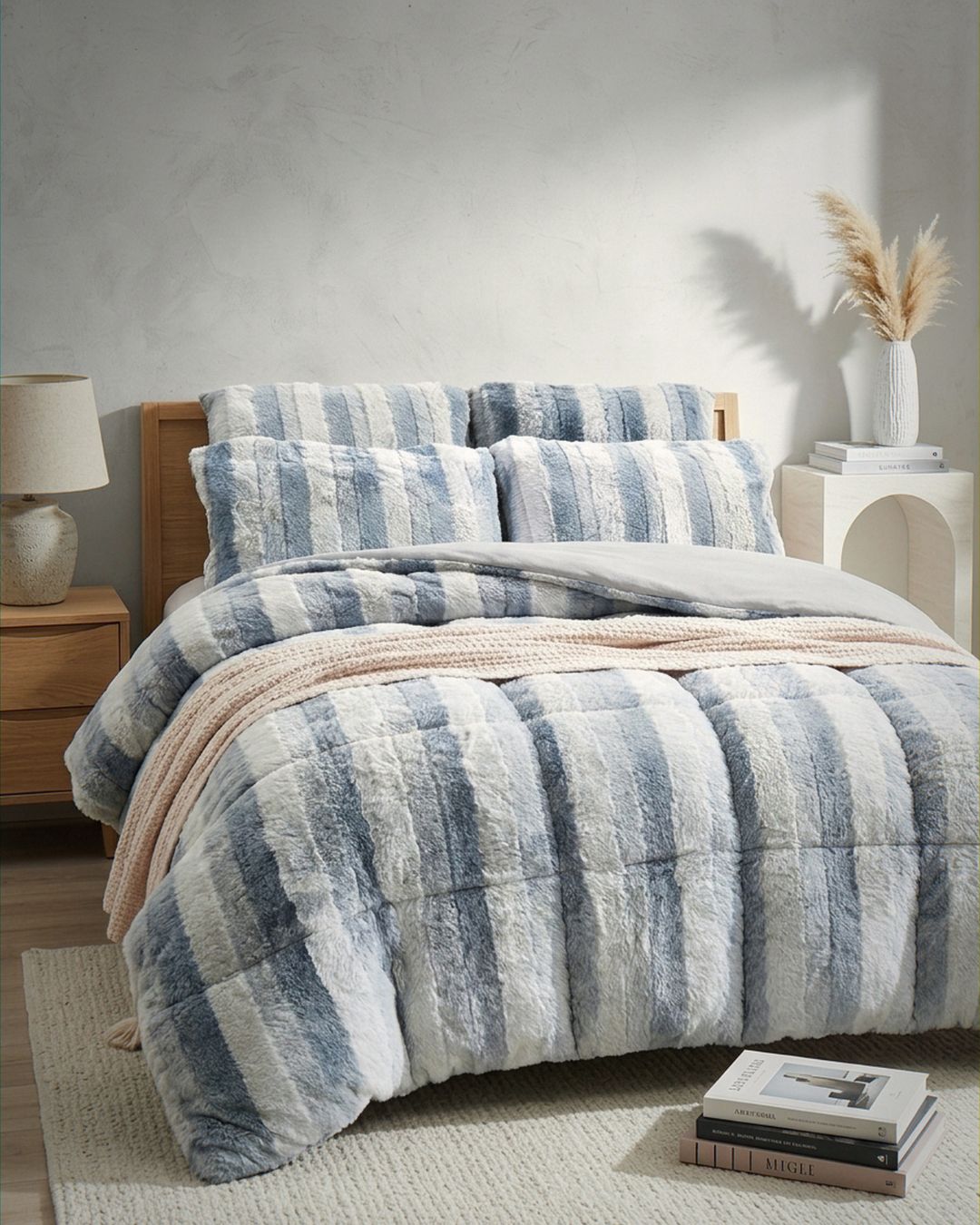 Morgan and Reid Silver Snow Rabbit Fur Comforter Set styled on a neatly made bed in a bright bedroom