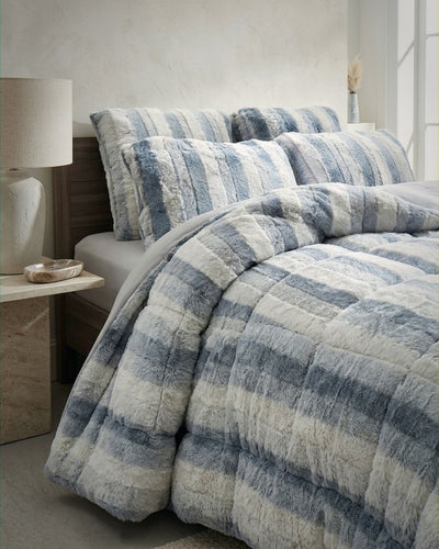 Overhead view of the Morgan and Reid Silver Snow Rabbit Fur Comforter Set on a made bed