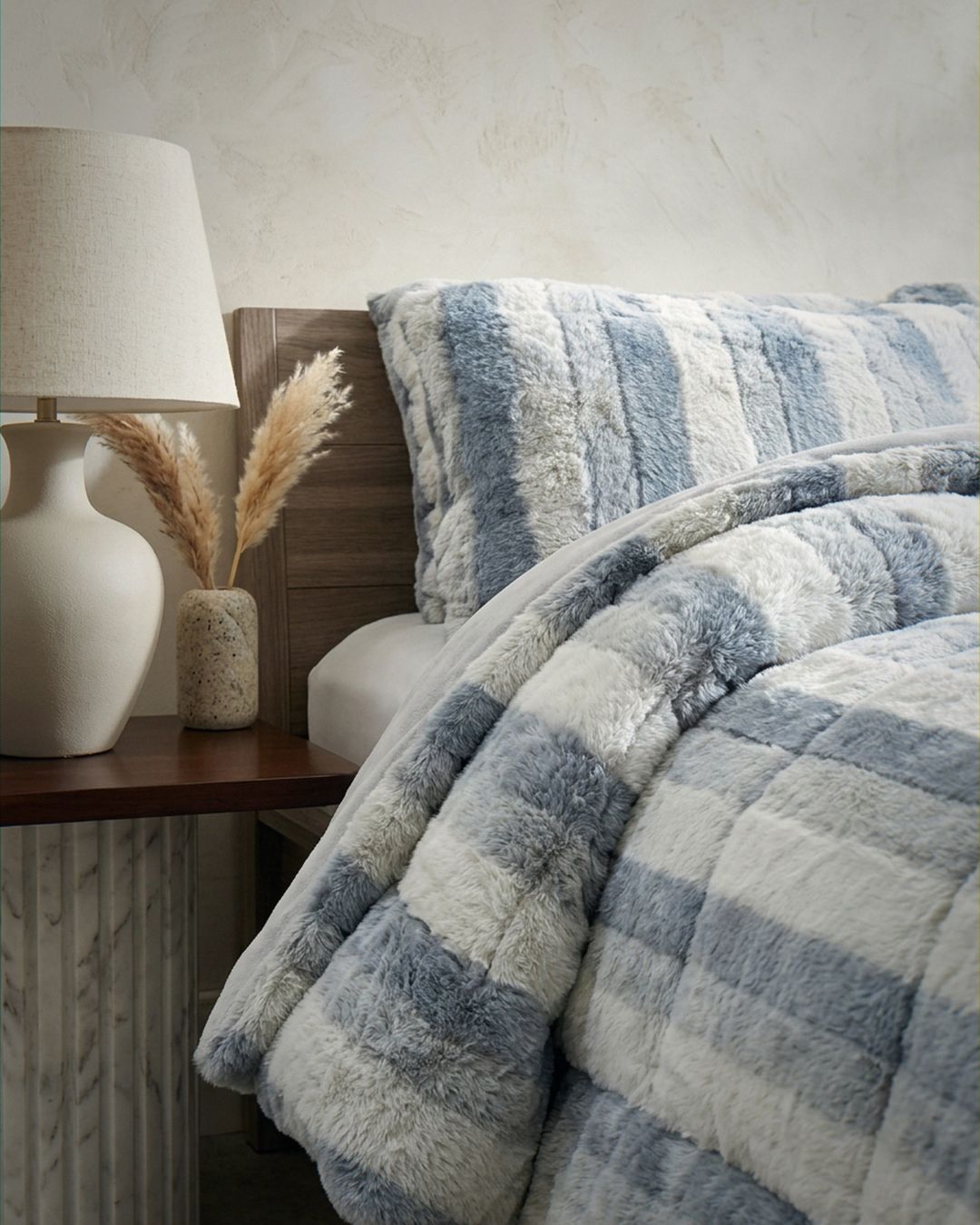Morgan and Reid Silver Snow Rabbit Fur Comforter Set in a cosy bedroom lifestyle setting