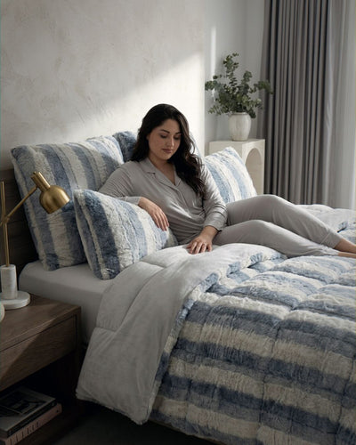 Morgan and Reid Silver Snow Rabbit Fur Comforter Set folded to show depth and plush texture