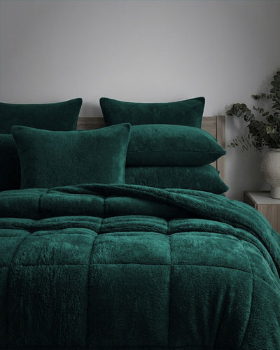 Morgan and Reid Forest Snuggle Fleece European Pillowcase Pair on bed with coordinating bedding