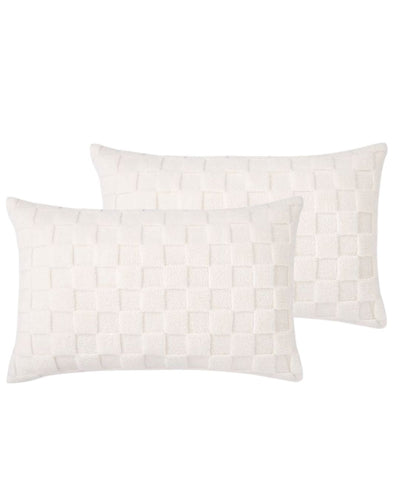 Morgan and Reid Checkered Cream Snuggle Fleece Pillowcase Pair on a styled bed with matching comforter