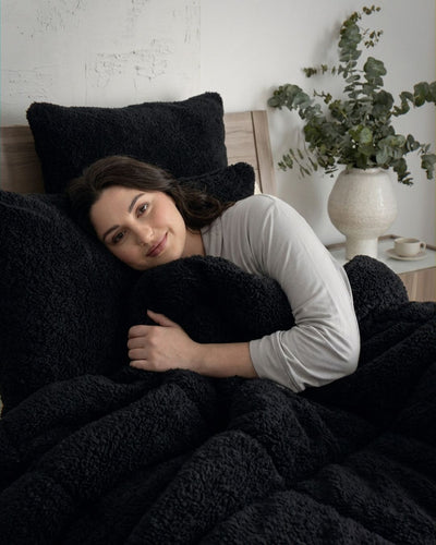 Detail shot of the Morgan and Reid Black Snuggle Fleece Comforter Set fabric and finish