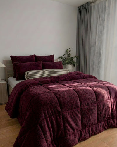Morgan and Reid Burgundy Black Snuggle Fleece Pillowcase Pair on bed with coordinating bedding