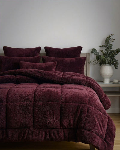 Close-up of the Morgan and Reid Burgundy Black Snuggle Fleece Pillowcase Pair showing fabric texture