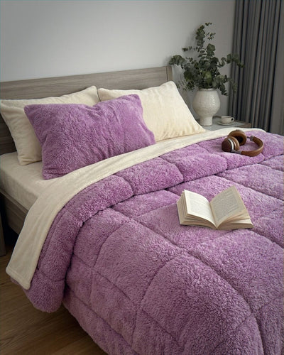Morgan and Reid Calm Lavender Snuggle Fleece Pillowcase Pair on bed with coordinating bedding