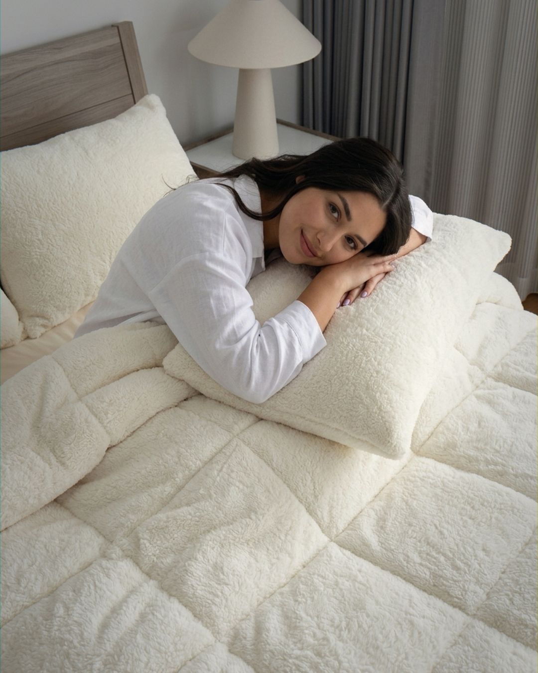 Morgan and Reid Ivory Snuggle Fleece Pillowcase Pair on bed with coordinating bedding