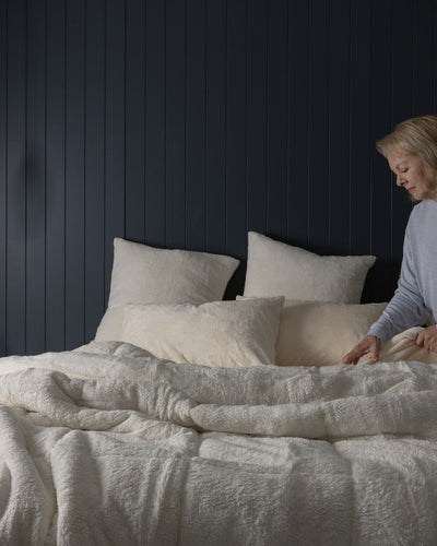 Detail shot of the Morgan and Reid Ivory Snuggle Fleece Comforter Set fabric and finish