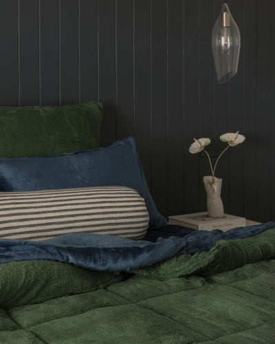 Morgan and Reid Jungle Snuggle Fleece European Pillowcase Pair on bed with coordinating bedding