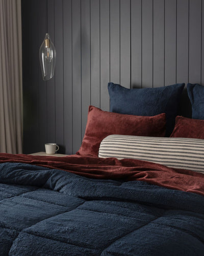 Close-up of the Morgan and Reid Midnight Blue Snuggle Fleece Comforter Set showing fabric texture and colour