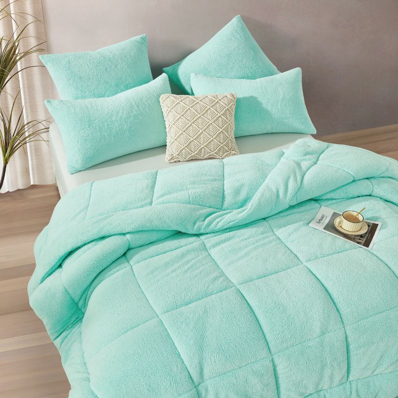 The Morgan and Reid Mint Snuggle Fleece European Pillowcase Pair features ultra-soft, textured fleece in light turquoise, shown against a white background.