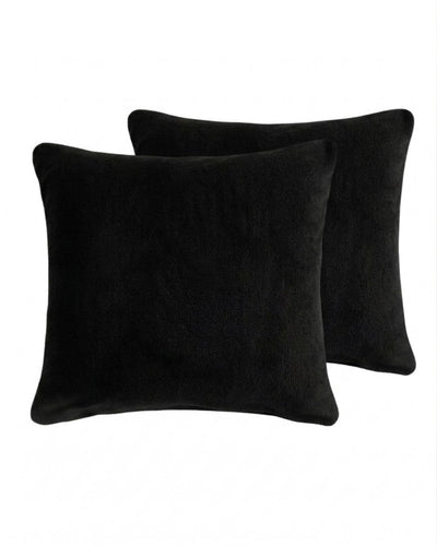 Morgan and Reid Black Snuggle Fleece European Pillowcase Pair on a styled bed with matching comforter