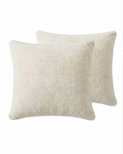 Morgan and Reid Ivory Snuggle Fleece European Pillowcase Pair on a styled bed with matching comforter