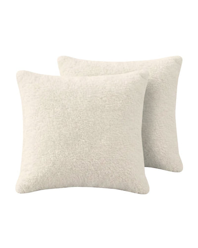 Morgan and Reid Bright White Snuggle Fleece European Pillowcase Pair on a styled bed with matching comforter