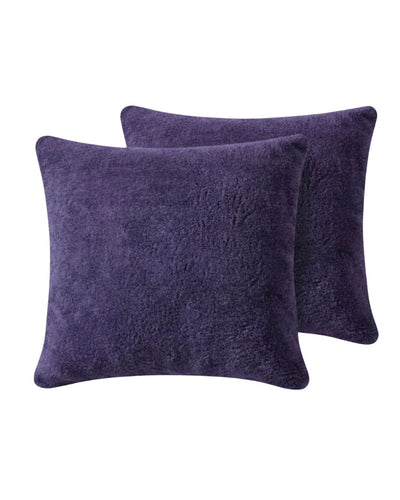 Morgan and Reid Mulberry Purple Snuggle Fleece European Pillowcase Pair on a styled bed with matching comforter