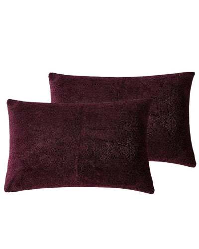 Morgan and Reid Burgundy Black Snuggle Fleece Pillowcase Pair on a styled bed with matching comforter