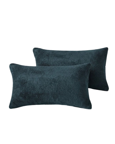 Morgan and Reid Deep Teal Snuggle Fleece Pillowcase Pair on a styled bed with matching comforter