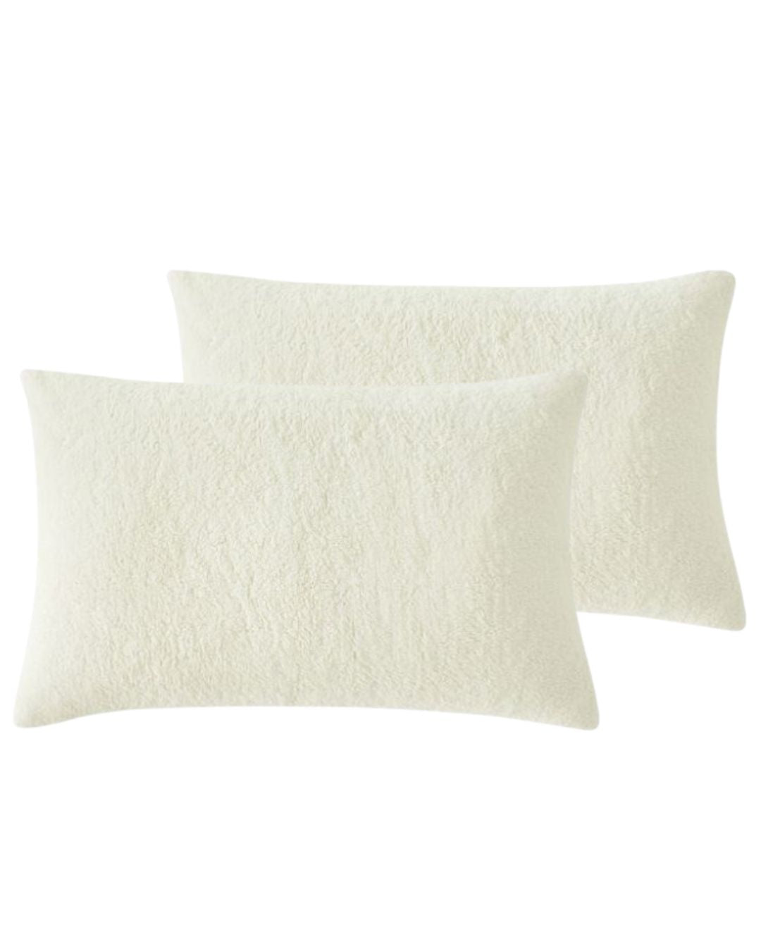 Morgan and Reid Ivory Snuggle Fleece Pillowcase Pair on a styled bed with matching comforter