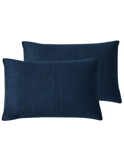 Morgan and Reid Midnight Blue Snuggle Fleece Pillowcase Pair on a styled bed with matching comforter