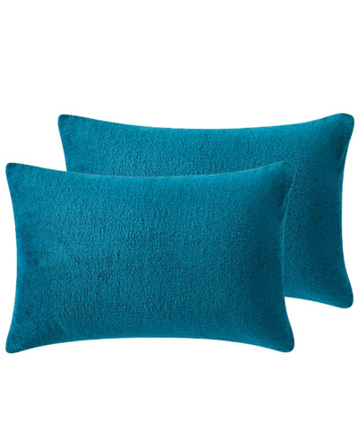 Morgan and Reid Riverside Snuggle Fleece Pillowcase Pair on a styled bed with matching comforter