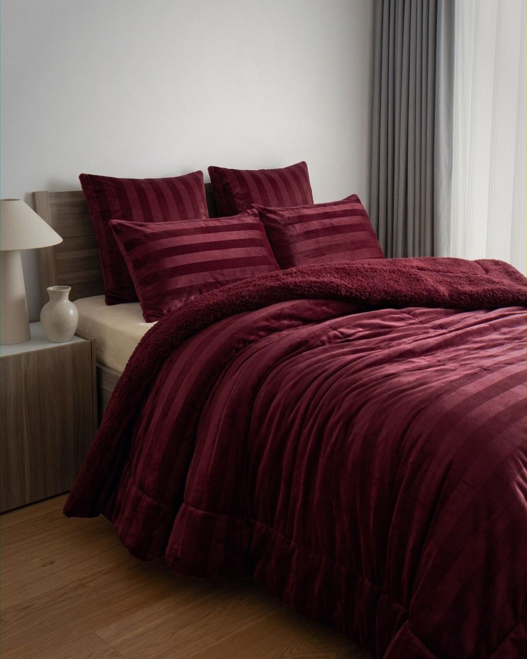 Overhead view of the Morgan and Reid Cherry Red Velvet Stripe Snuggle Fleece Comforter Set on a made bed