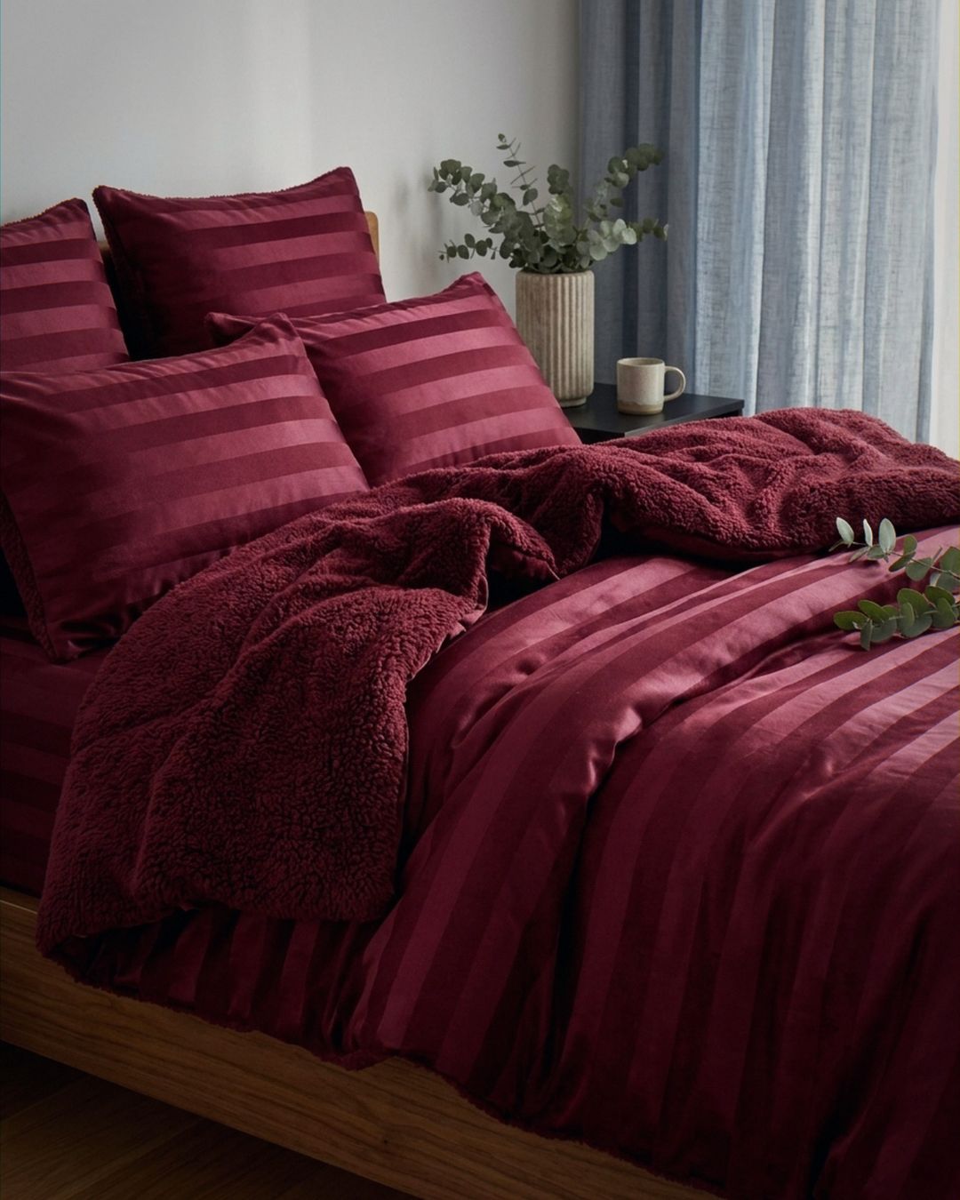 Morgan and Reid Cherry Red Velvet Stripe Snuggle Fleece European Pillowcase Pair on bed with coordinating bedding