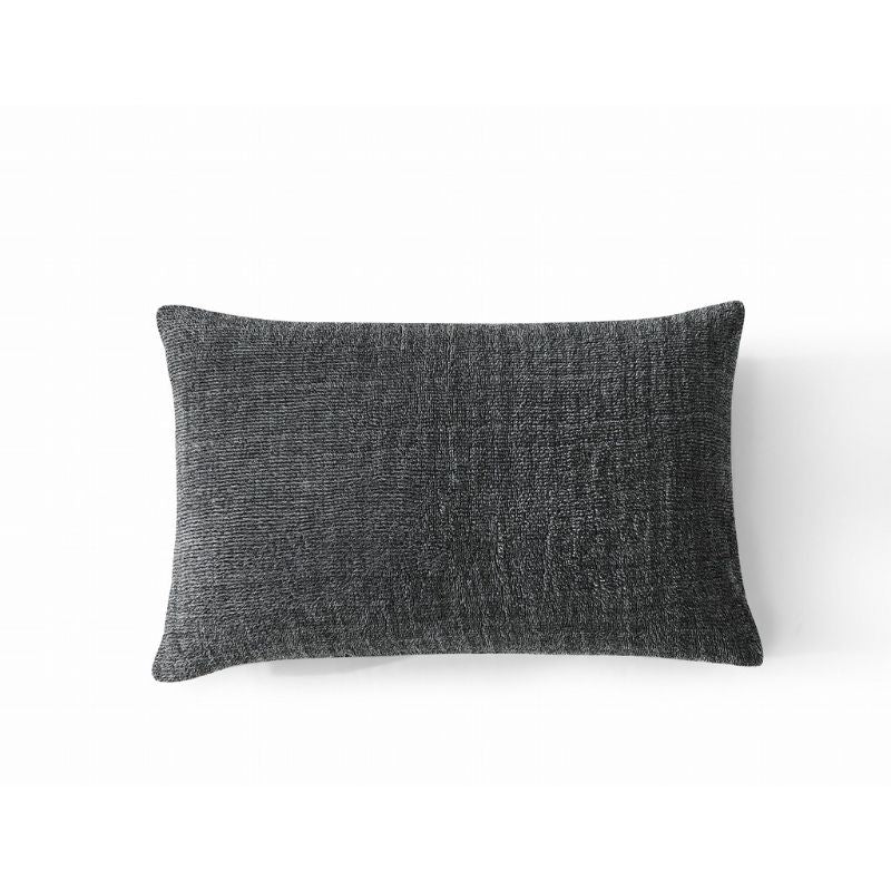 A rectangular, dark gray textured pillow is shown against a white background, ideal for cosy bedding. Pair it with the Morgan and Reid Black White Snuggle Fleece Pillowcase Pair for style and comfort.