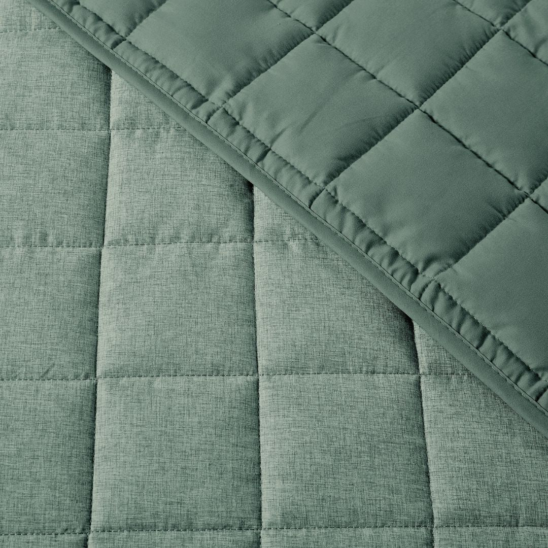 close up of quilting fabric of green quilt