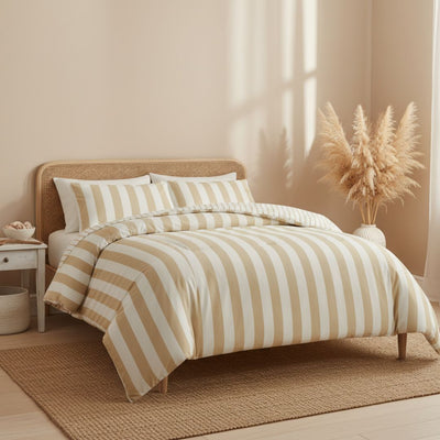 Bedroom with striped bedding and a woven headboard