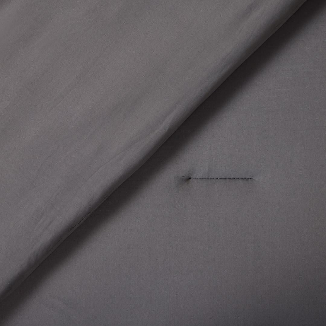 Lightweight cooling comforter with matching pillowcases in deep grey.