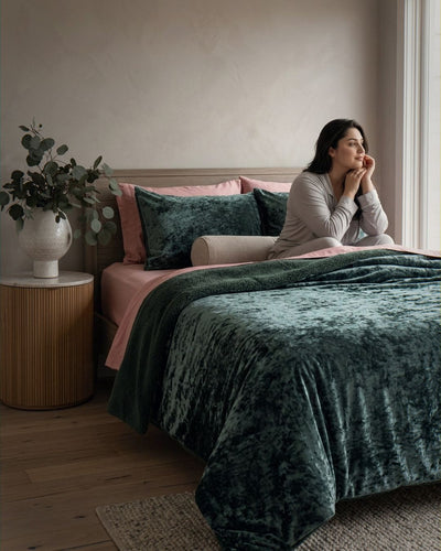Morgan and Reid Sage Velvet Crushed Snuggle Fleece Pillowcase Pair on bed with coordinating bedding