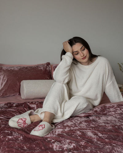 Morgan and Reid Shell Pink Velvet Crushed Snuggle Fleece Comforter Set folded to show depth and plush texture